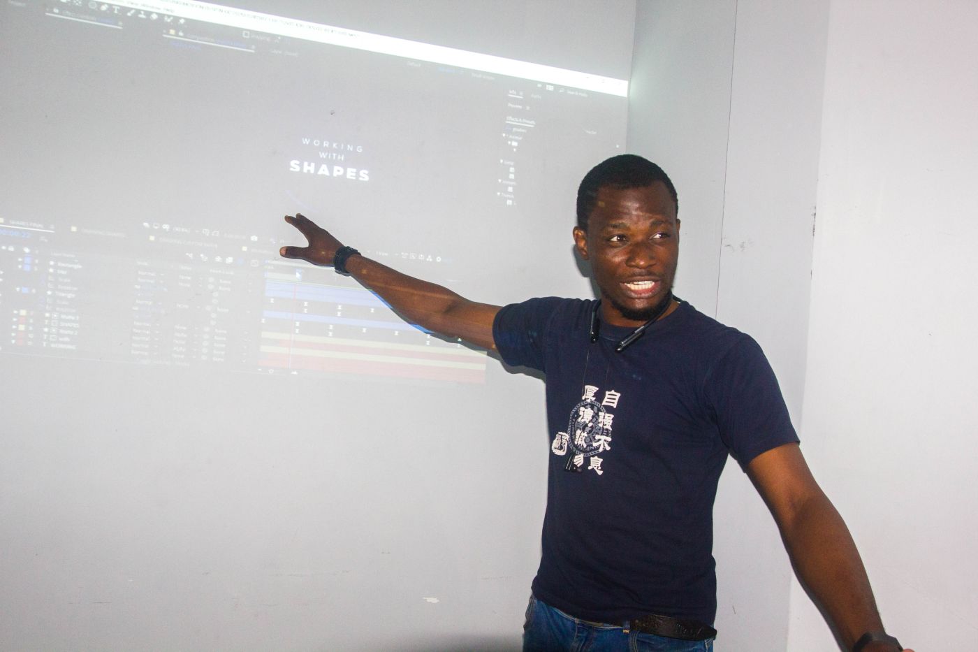 Nas teaching a class at N Academy, pointing at the screen