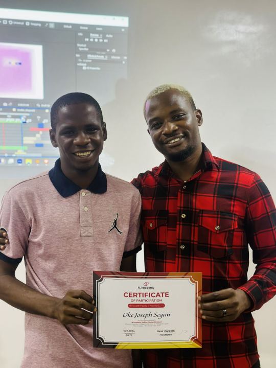 Nas with a graduate and their certificate