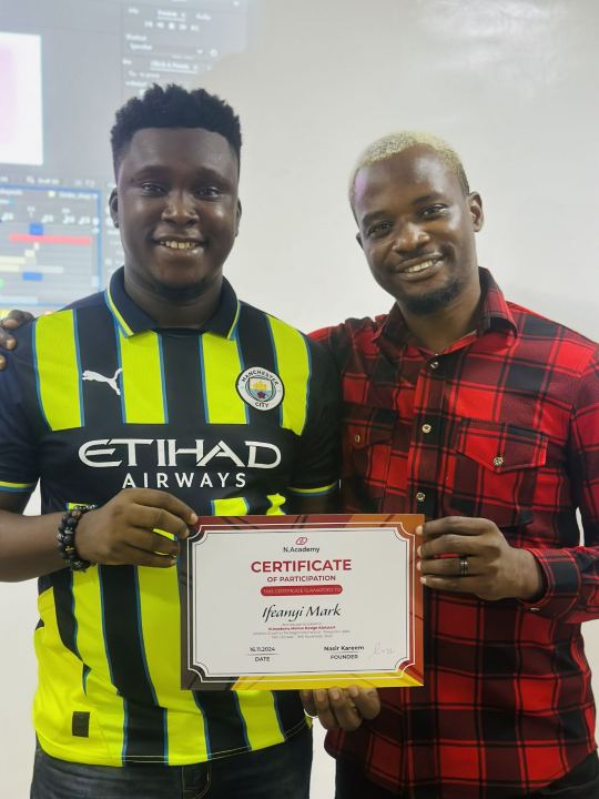 Nas with a graduate and their certificate