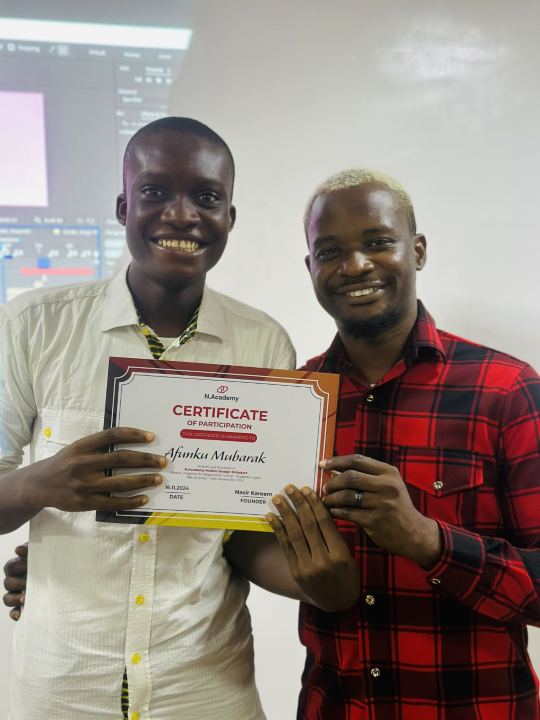 Nas with a graduate and their certificate