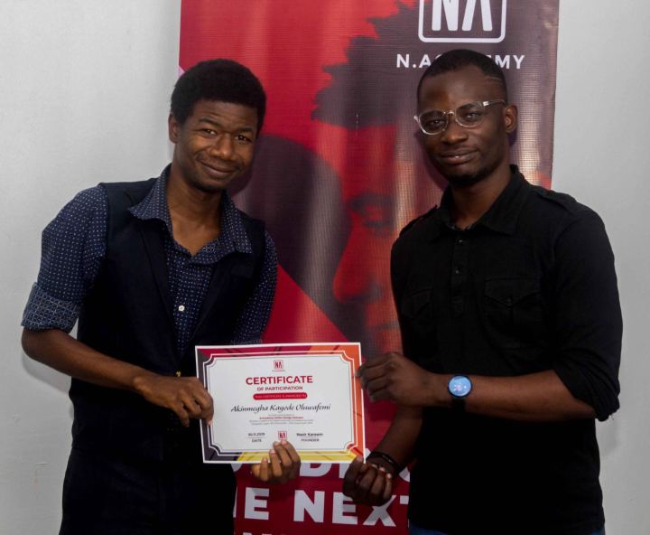A graduate receiving their N Academy certificate