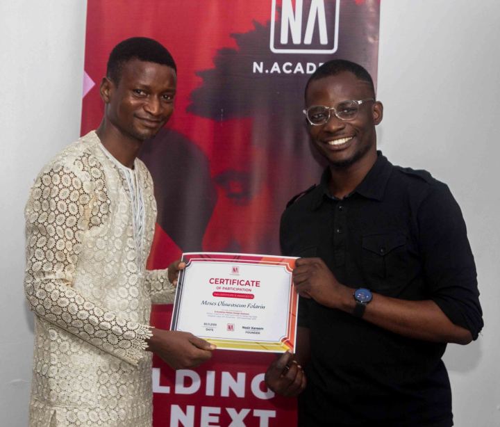 A graduate receiving their N Academy certificate