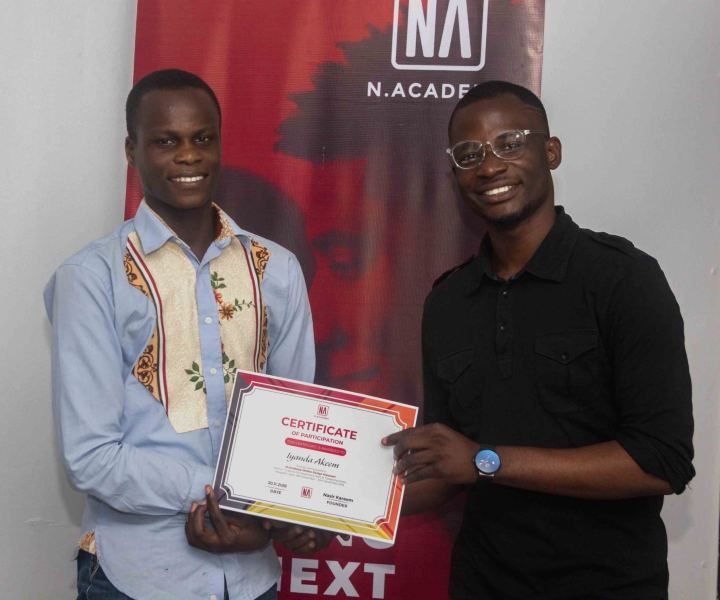 A graduate receiving their N Academy certificate