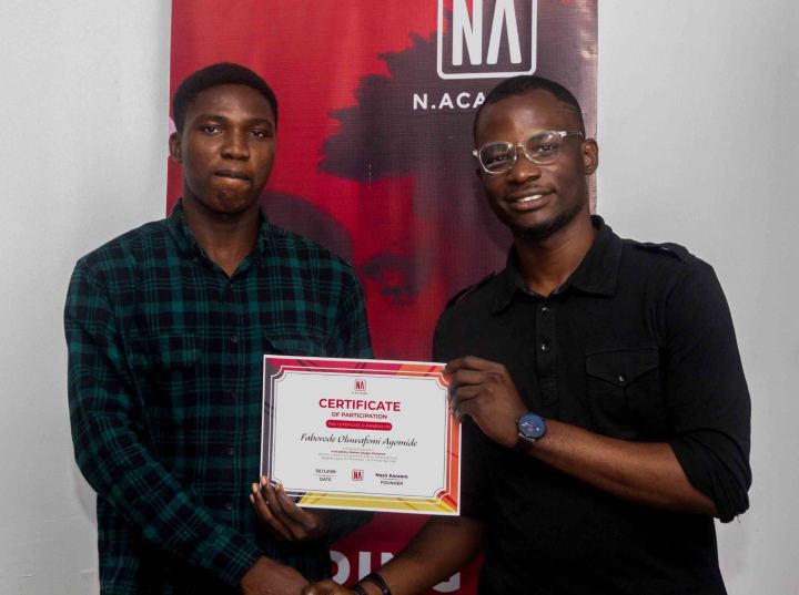 A graduate receiving their N Academy certificate