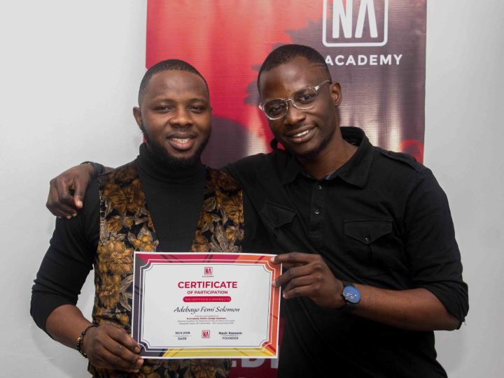 A graduate receiving their N Academy certificate