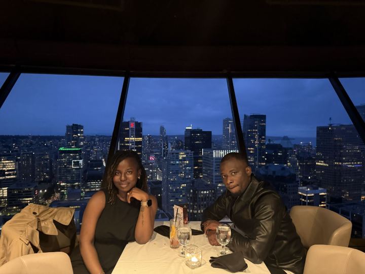 Nas and Praise at dinner overlooking the city