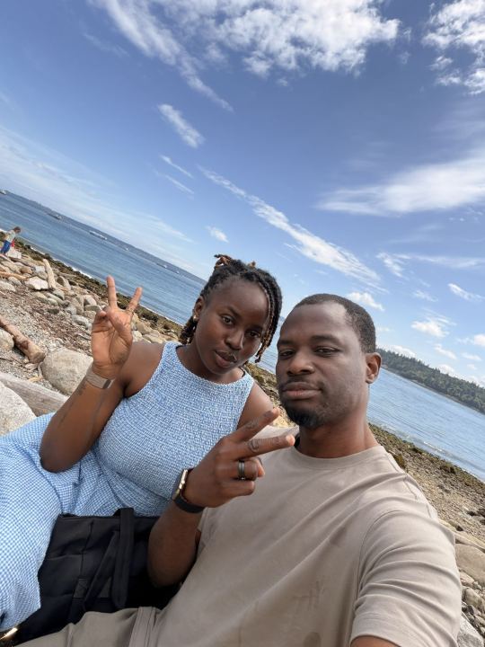Nas and Praise taking a selfie by the beach