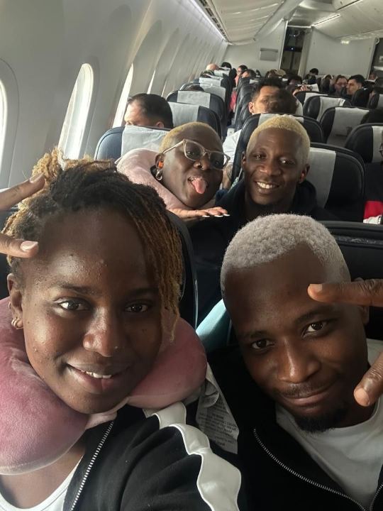 Nas and friends on a flight