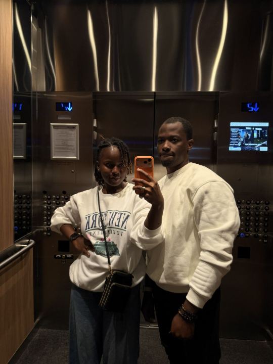 Nas and Praise taking a mirror selfie
